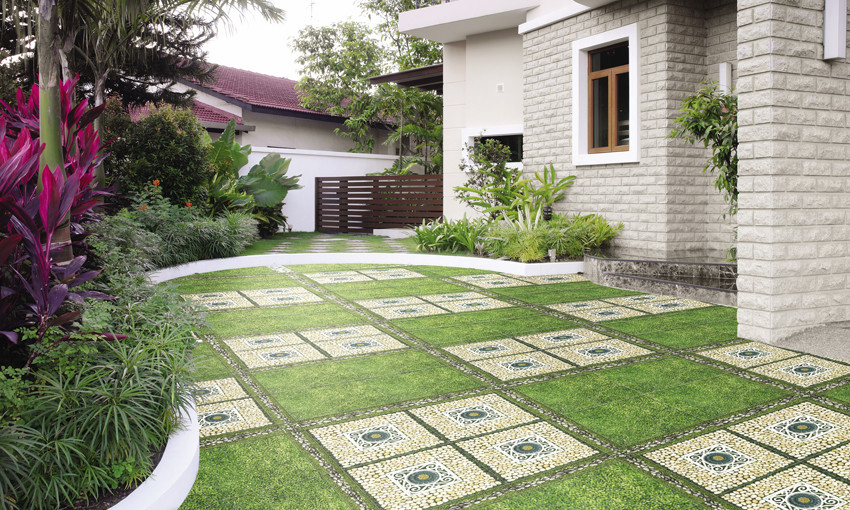 Mẫu gạch lát sân vườn kết hợp cả sỏi đá và cỏ như thế này chắc chắn sẽ giúp khu vườn nhà bạn trở nên sinh động và hấp dẫn hơn. Ảnh: Gachtrungdo.