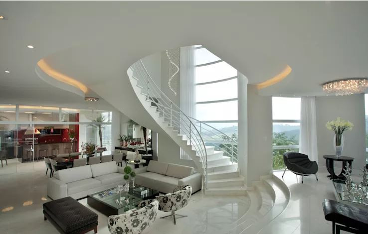 Nằm gọn gàng ở một góc nhà, mẫu cầu thang xoắn ốc trắng tinh khôi khiến không gian bên trong ngôi nhà trở nên sang trọng hơn hẳn. Ảnh: Homify.