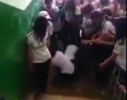 Nu sinh cap 2 bi ban danh hoi dong da man o Dong Nai