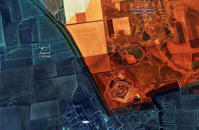 Từ ngày 11 đến ngày 12/10, lực lượng dân quân Donetsk được tổ chức lại (sát nhập vào quân đội Nga) đã vượt qua tuyến đường sắt và tiến đến làng Berdychi, sau đó tiến về Stepove; tấn công Núi xỉ thải nằm ở phía đông bắc Nhà máy luyện cốc. Cùng lúc đó ở sườn nam, quân Nga tấn công vào Vodyane.