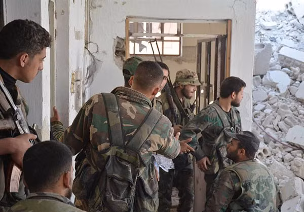 Được biết, lực lượng chính phủ Damascus đã giải phóng nhiều vùng đất rộng lớn với 47 tòa nhà từng được các nhóm phiến quân sử dụng làm căn cứ ở quận Al-Qaboun. Ảnh: FNA.