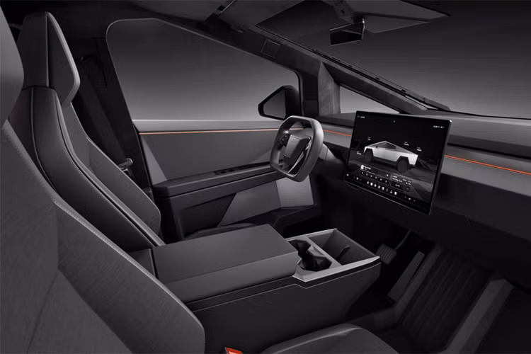 Nội thất của Tesla Cybertruck Long Range ở mức đủ dùng với ghế bọc chất liệu Textile màu đen có sưởi, hệ thống âm thanh tiêu chuẩn 7 loa, màn hình trung tâm 18.5 inch nhưng không được trang bị màn hình sau 9.4 inch.
