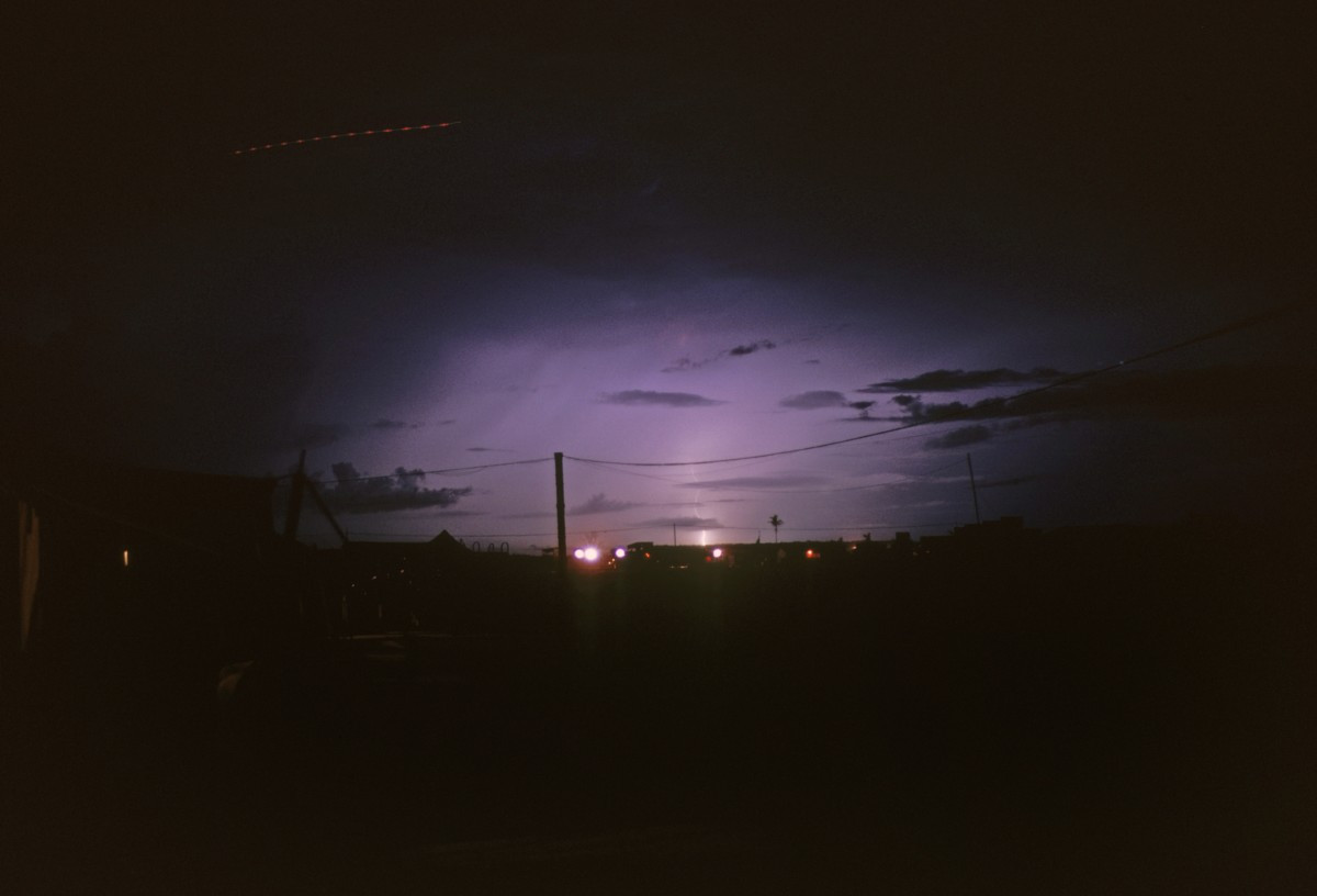 Căn cứ Mỹ ở Củ Chi rực sáng trong một ánh chớp vào mùa mưa. Ảnh: Warren Welch.