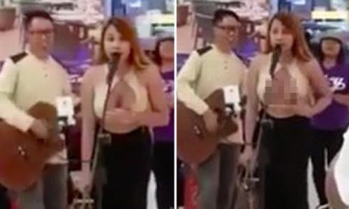 Cô nàng chuyển giới để lộ ngực trần hát trước siêu thị Co nang chuyen gioi de lo nguc tran hat truoc sieu thi
