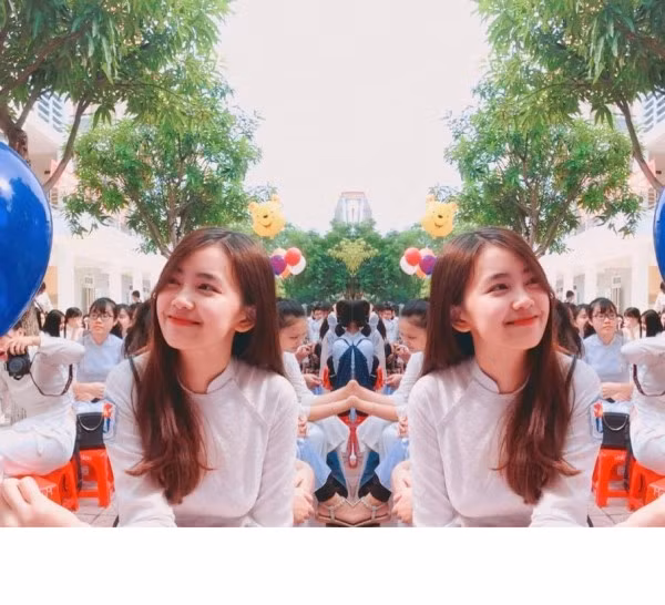 Nữ sinh trong loạt ảnh này thực sự dễ khiến các các chàng trai, nam sinh cảm mến ngay từ cái nhìn đầu tiên. Trong tà áo dài trắng tinh khôi, cô nàng khoe nụ cười cực duyên cùng khuôn mặt rất ưa nhìn, đáng yêu. Khung cảnh sân trường và màu sắc rực rỡ cũng khiến loạt ảnh thêm hấp dẫn. Nhân vật chính sau đó đã nhận được vô vàn lời khen từ cư dân mạng. Nhiều chàng trai thậm chí nóng ruột muốn truy lùng thông tin, trang cá nhân của cô nàng để được làm quen, được ngắm nghía thêm nhiều bức ảnh đẹp khác.