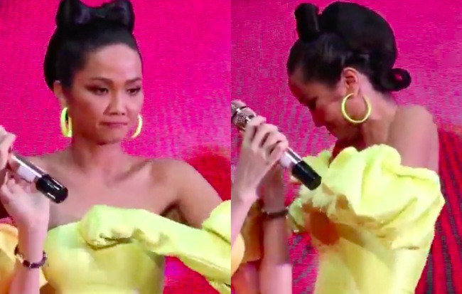 Hình ảnh kém duyên của H'hen Niê lọt vào ống kính khiến người đẹp không biết giấu mặt đi đâu cho hết ngại ngùng. Thậm chí các thí sinh nam phải đứng che chắn để H'hen Niê lùi về phía sau kéo váy.