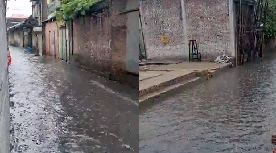 Trong ảnh là trận mưa ngày 1/8, biến cả đoạn đường dài của ngõ 55 thôn Cao Hạ bị ngập sâu trong nước do ảnh hưởng bởi các công trình lấn chiếm đất mương.