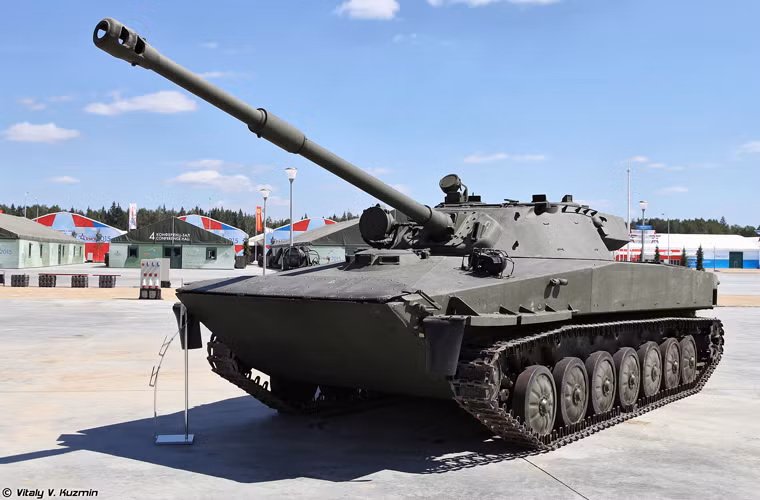 Tất nhiên việc thay pháo chính bắt buộc thay tháp pháo cũ trên PT-76 bằng tháp mới, có phần lớn hơn nhưng thấp hơn và phần đuôi tháp pháo dài ra.