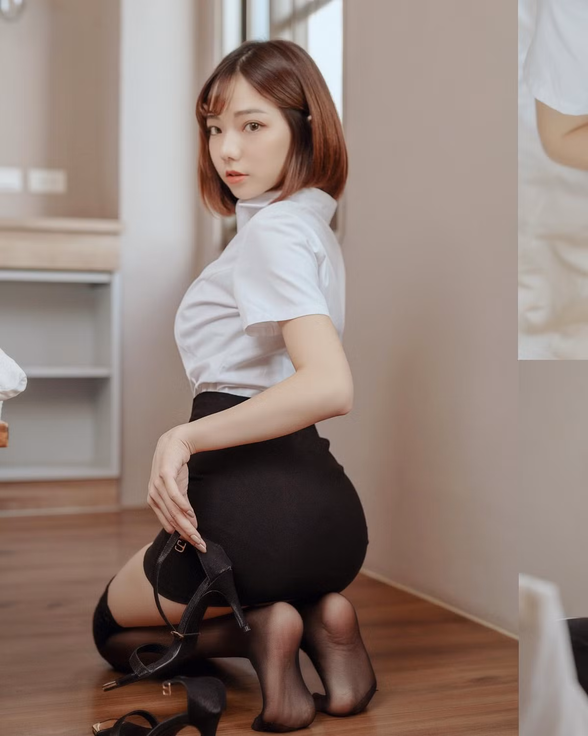 Khi diện đồ công sở, dù rất kín đáo, hot girl vẫn vô cùng gợi cảm và cuốn hút.