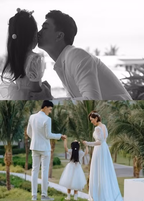 Vợ chồng Khương Ngọc khoe con gái trong đám cưới. Ảnh: Zing.