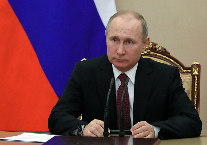 Ông Putin trong một lần chủ trì cuộc họp của Hội đồng An ninh Quốc gia tại Matxcơva - Ảnh: REUTERS