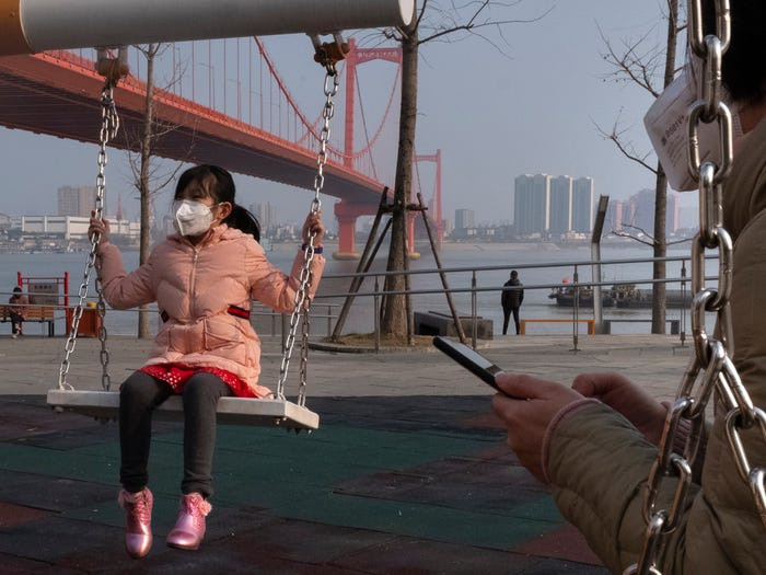 ...hoặc đưa trẻ ra ngoài chơi. Ảnh: AP