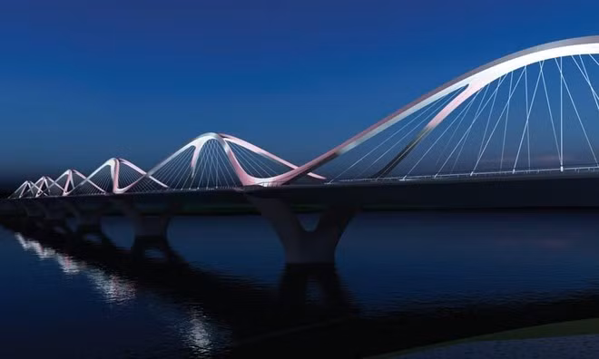 Cầu Trần Hưng Đạo dài 2,4 km, nối quận Hoàn Kiếm với quận Long Biên, sử dụng kết cấu cầu chính dạng vòm thép, mặt cắt ngang cầu tại giữa nhịp rộng 40,66m, tại trụ cầu rộng 47,76m. Ảnh: Hoinhabaovietnam.