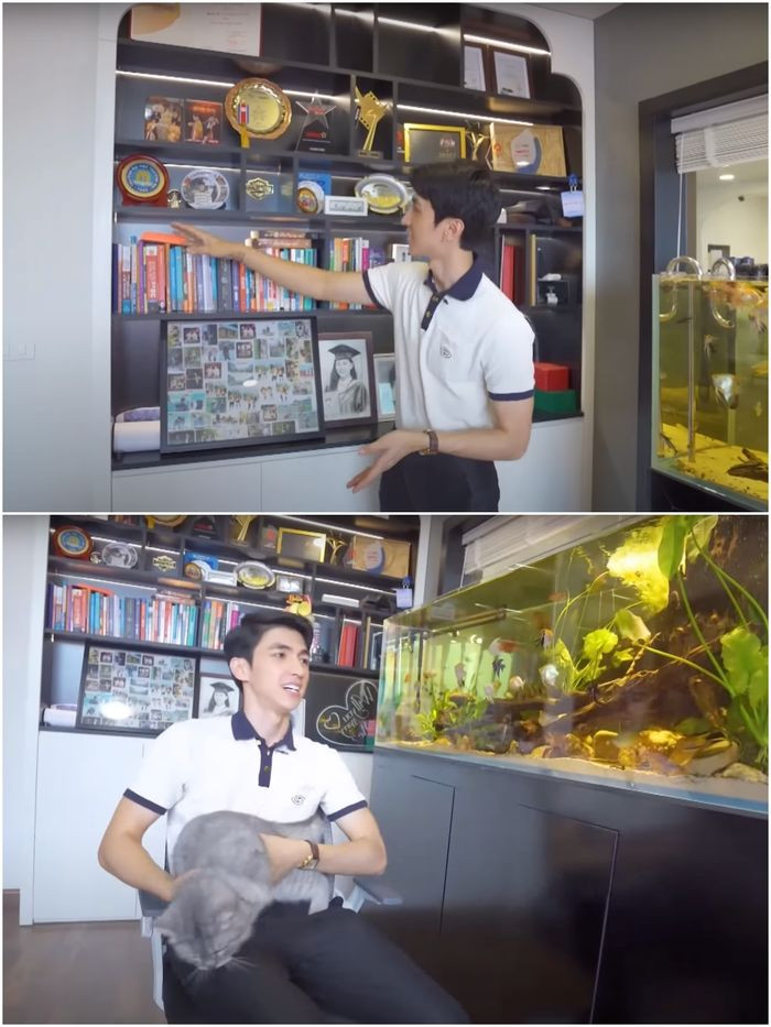 Phòng làm việc có bể cá lớn và góc tủ bày nhiều vật kỷ niệm. Ảnh: YouTube Phương Nga Bùi Official