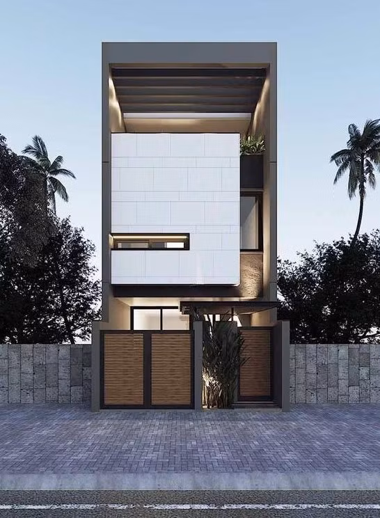 Điểm nhấn của ngôi nhà nằm ở khu vực tầng hai với khối hộp ốp đá màu trắng thiết kế nhô ra phía trước. Ảnh: Kientrucxaydung