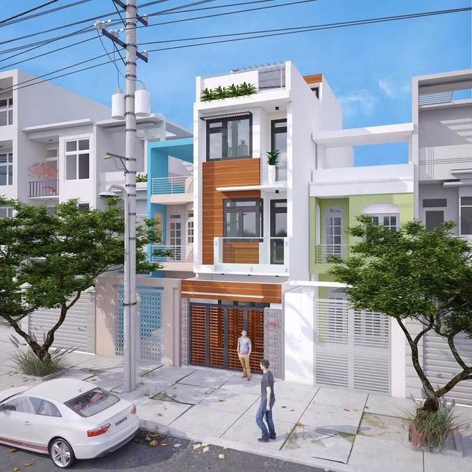 Mặt tièn nhà ống 3 tầng 70m2 nổi bật với gam màu trắng chủ đạo cùng tường ốp gạch giả gỗ. Ảnh: Wedo