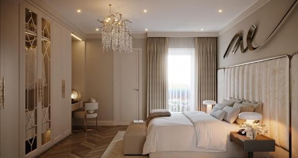 Phòng ngủ rộng rãi với giường lớn, tủ quần áo có tông màu trắng chủ đạo.