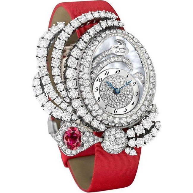 Breguet là thương hiệu đồng hồ nổi tiếng nằm trong phân khúc cao cấp. Bộ khung đồng hồ được làm hoàn toàn từ vàng trắng. Vòng bezel và bề mặt số của đồng được khảm 343 viên kim cương cùng 1 viên ruby đỏ 1,3 carat. Ảnh: Internet