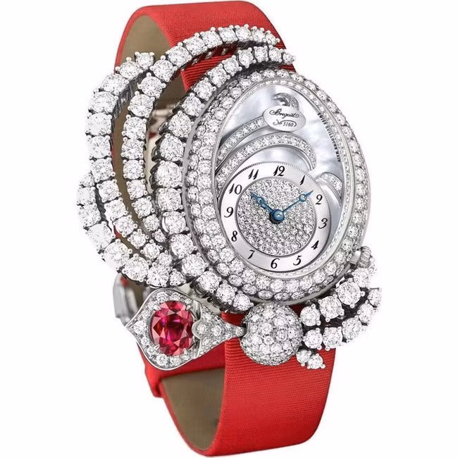 Breguet là thương hiệu đồng hồ nổi tiếng nằm trong phân khúc cao cấp. Bộ khung đồng hồ được làm hoàn toàn từ vàng trắng. Vòng bezel và bề mặt số của đồng được khảm 343 viên kim cương cùng 1 viên ruby đỏ 1,3 carat. Ảnh: Internet