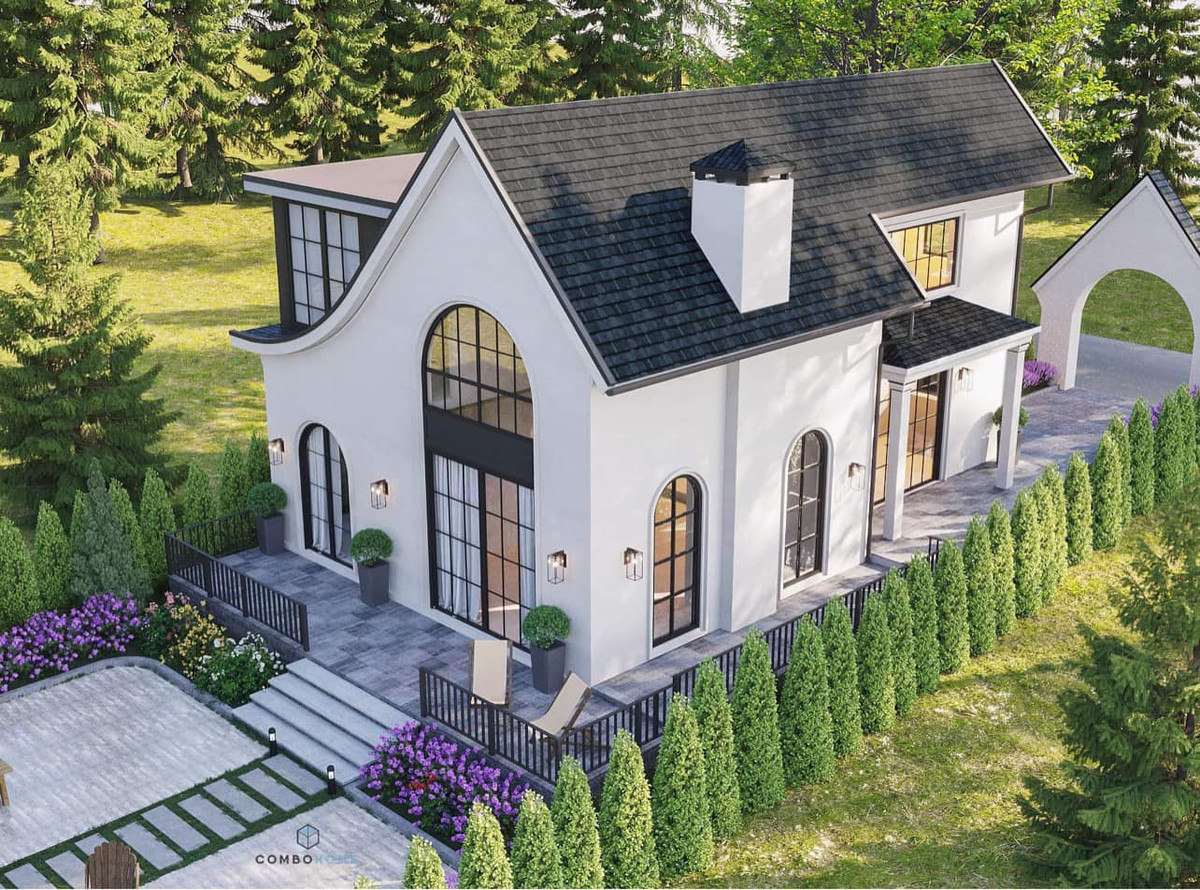 Xung quanh biệt thự là không gian cỏ và cây xanh mướt.