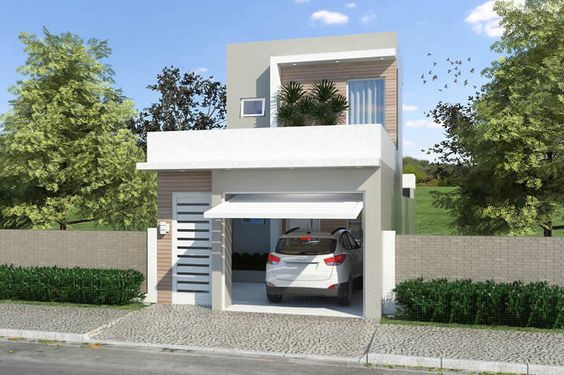 Vẫn hình khối vuông vắn nhưng ngôi nhà vẫn có điểm nhấn khi bức tường được cách điệu. Ảnh: Wedo