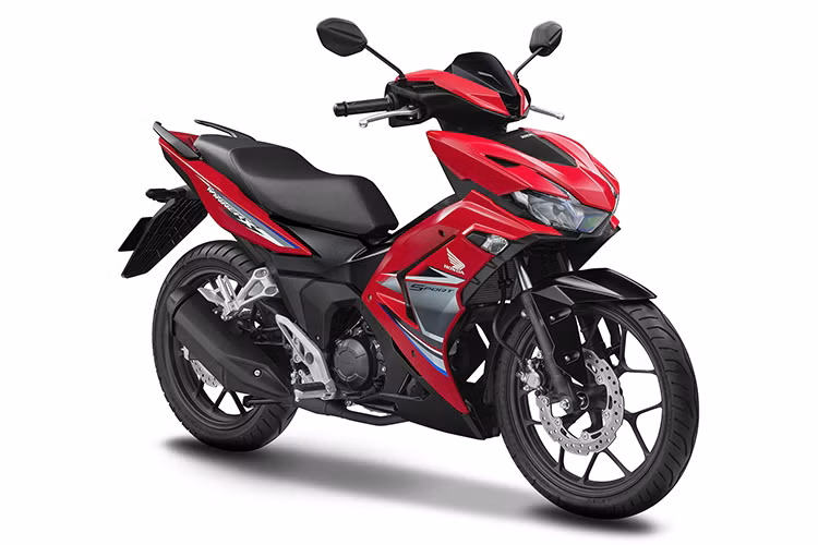  Honda Winner X 2022 mới sở hữu thiết kế mang tính khí động học cao, trở thành nét đặc trưng mạnh mẽ trong DNA của mẫu xe. Mặt nạ trước được khoác lên mình một bộ giáp ngoại hình mới đậm chất ngầu, góc cạnh với các đường cắt nét tạo hình chữ V nổi bật sự năng động. 