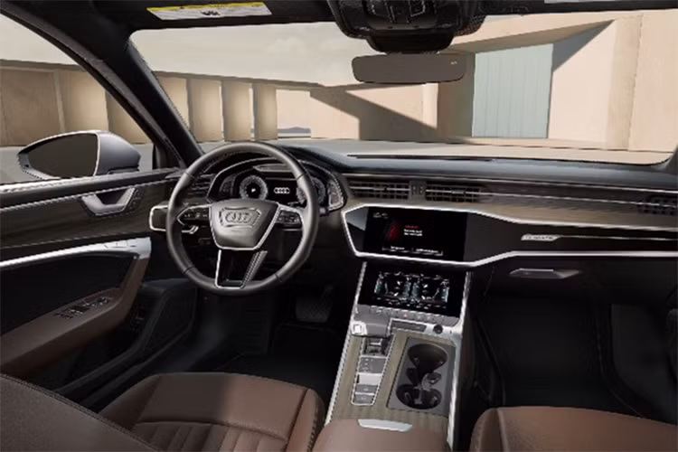 Khoang nội thất A6 S line 40 TFSI hội tụ nhiều tiện nghi với vô-lăng bọc da 3 chấu mới, tích hợp lẫy chuyển số, tùy chọn chế độ lái Audi Drive Select. Bảng đồng hồ kỹ thuật số Audi Virtual Cockpit Plus 12,3 inch, màn hình cảm ứng giải trí MMI Touch Response 10,1 inch và một màn hình phụ trợ 8,6 inch cho hệ thống điều hòa 4 vùng. Hàng ghế trước chỉnh điện, nhớ vị trí ghế lái, hỗ trợ tựa lưng 4 chiều. Đèn viền nội thất, hỗ trợ kết nối Apple CarPlay/Android Auto.