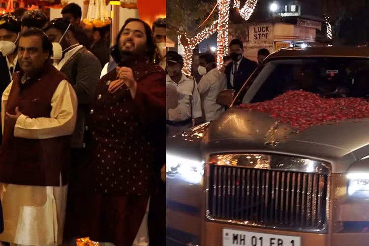 Chiếc Rolls-Royce Cullinan Black Badge của Anant Ambani nổi bật trên đường phố với màu sơn ngoại thất cam cùng một đoàn xe an ninh hộ tống.