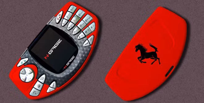 Nokia N-Gage - Khi chơi game trên điện thoại vẫn là khái niệm xa lạ thì Nokia đã tung ra một sản phẩm làm thay đổi suy nghĩ của chúng ta. Chiếc N-Gage có ngoại hình thiết kế như tay cầm chơi game thời hiện đại, từ kiểu dáng bo tròn cho đến hệ thống nút bấm. Với sản phẩm này, Nokia đã tạo nên trào lưu chơi game điện thoại trên toàn thế giới. Ảnh: Deviantart.