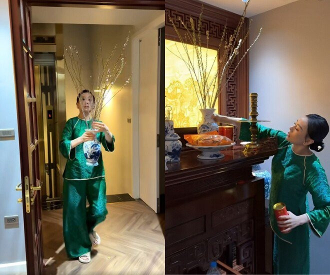 Nữ diễn viên tự tay cắm bình hoa đào bày biện lên bàn thờ. Ảnh chụp màn hình