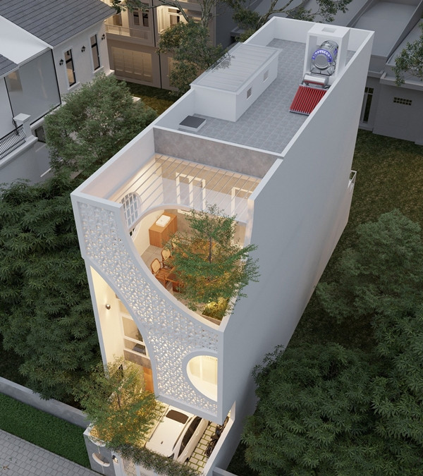 Gạch bông gió cùng các khoảng rỗng đan xen, phát huy chức năng lấy sáng, thông thoáng và tạo hiệu ứng hắt đèn ban đêm, góp phần tăng tính thẩm mỹ cho nhà phố. Ảnh: SBS House