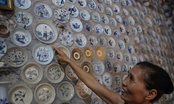 Theo bà Hồ Thị Nga - vợ ông Trường, tâm nguyện của chồng bà là muốn giữ gìn nét đẹp văn hóa của đất nước. Ảnh: Vietnamnet