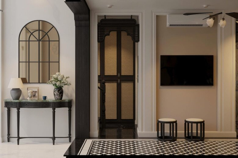 Điểm nhấn là chiếc gương lớn hình vòm kiểu cổ điển, kết hợp lọ hoa và bàn ghế tối giản. Ảnh: FBNV