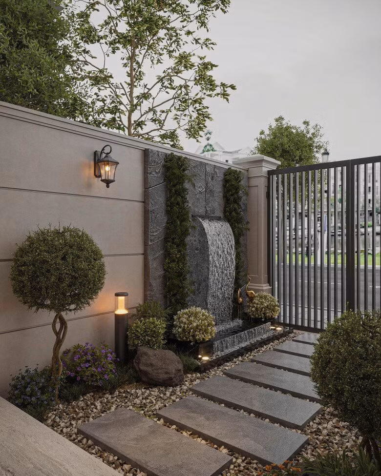 Thác nước nhỏ kết hợp cây xanh, ánh sáng tạo điểm nhấn. Ảnh: FB Hằng Túi