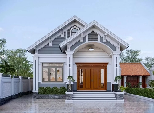 Nhà mái Thái tân cổ điển xây trên khu đất diện tích 100m2, có sân vườn rộng rãi, tạo nên không gian sống xanh mát, trong lành. Ảnh: Vinavic