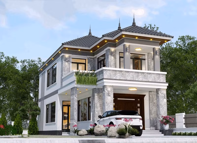 Nhà mái Nhật 2 tầng tân cổ điển sử dụng các đường nét hoa văn cầu kỳ, mang đến sự sang trọng, quý phái. Ảnh: Shome