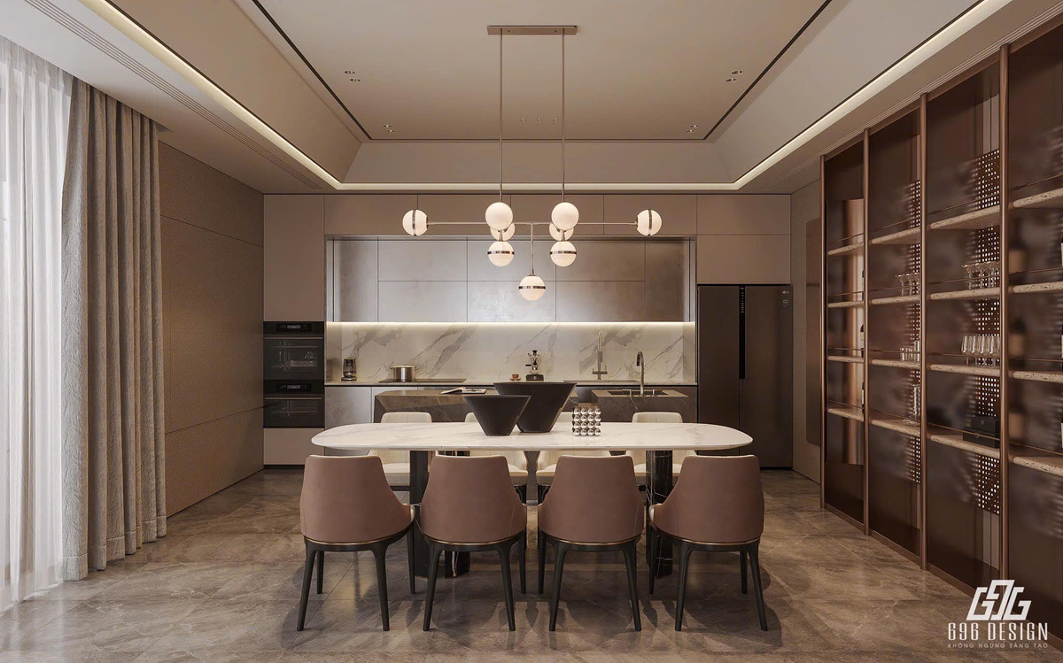 Phòng bếp có bàn bếp rộng, bàn đảo cùng 2 bồn rửa, kệ tủ to để đựng rượu và ly. Ảnh; FB Đoàn Văn Hậu