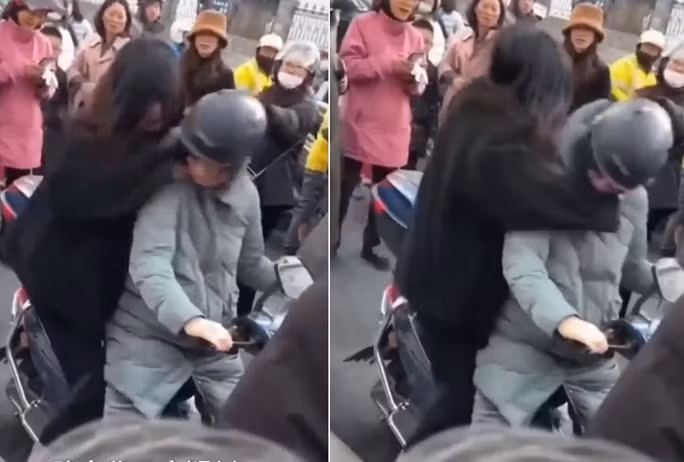 Soc: Khong duoc mua cho dien thoai, nu sinh danh me giua duong