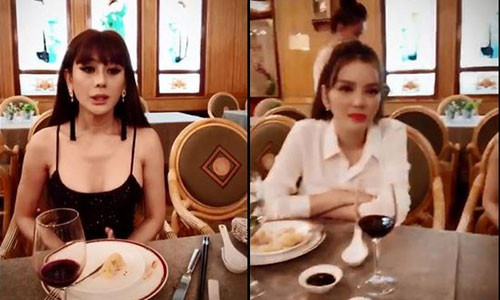 Lâm Khánh Chi ngồi cạnh Lý Nhã Kỳ tại sự kiện tối 6/6. (Ảnh cắt từ clip).