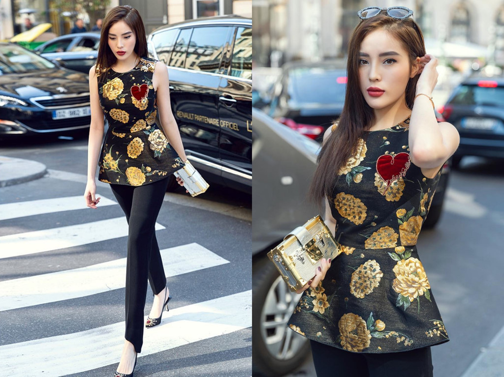 Trước đó, Kỳ Duyên sải bước trên đường phố Paris với set đồ hiệu của Dolce &amp; Gabbana, gồm áo peplum điểm xuyết hoa văn nổi bật (gần 22 triệu đồng), quần âu ôm dáng tối màu. Cô trưng dụng clutch phom dáng cứng cáp của LV (gần 130 triệu đồng) và mắt kính Miu Miu.