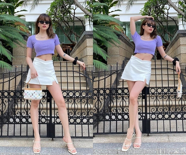 Ngoài phối với quần, áo croptop còn được người đẹp khéo léo kết hợp với váy ngắn. Vừa khoe bụng phẳng lì vừa khoe được đôi chân thon dài.