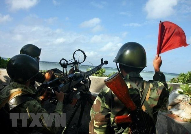 Chiến sỹ Hải quân khẩu đội súng máy phòng không 12,7 mm ngày đêm luyện tập, nâng cao cảnh giác, sẵn sàng chiến đấu bảo vệ quần đảo Trường Sa của Tổ quốc. (Ảnh: Phương Hoa/TTXVN)