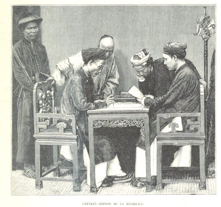 Các nhà nho ngồi bàn giấy với các gia nhân ở xung quanh.