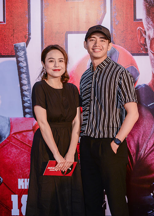 Xuất hiện tại buổi ra mắt phim "Deadpool 2", Quang Đăng - Thái Trinh gây chú ý. Cặp đôi diện trang phục tông đen, trông rạng rỡ bên nhau.