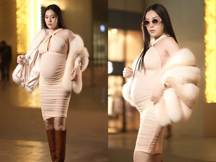 Phương Oanh khoe bụng bầu vượt mặt với váy body cổ yếm khoe vai trần. Ảnh: Người Đưa Tin.