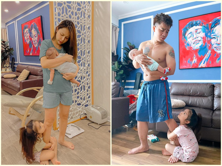 Bé Thóc rất nhí nhảnh. Cô nhóc ôm chân bố mẹ khi bố mẹ bồng em trai.