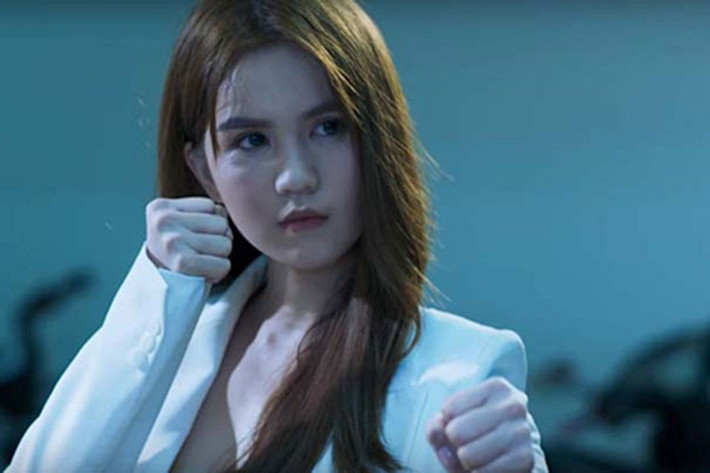 Sau "Vòng eo 56", Ngọc Trinh tiếp tục bỏ tiền túi sản xuất và đóng vai chính dự án phim ngắn "Giải mã NT56". Trong phim, cô hóa thân một nữ vệ sĩ. Ảnh: Dân Việt