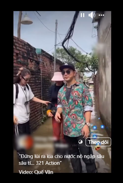 Vợ chồng Ưng Hoàng Phúc - Kim Cương và Quế Vân đang trở thành tâm điểm khi đi trao quà cho bà con ở Phúc Tân (Hoàn Kiếm, Hà Nội). Điều khiến cư dân mạng bàn tán là việc bộ ba lựa chọn góc quay, bị nghi diễn. Ảnh: FB Quế Vân.