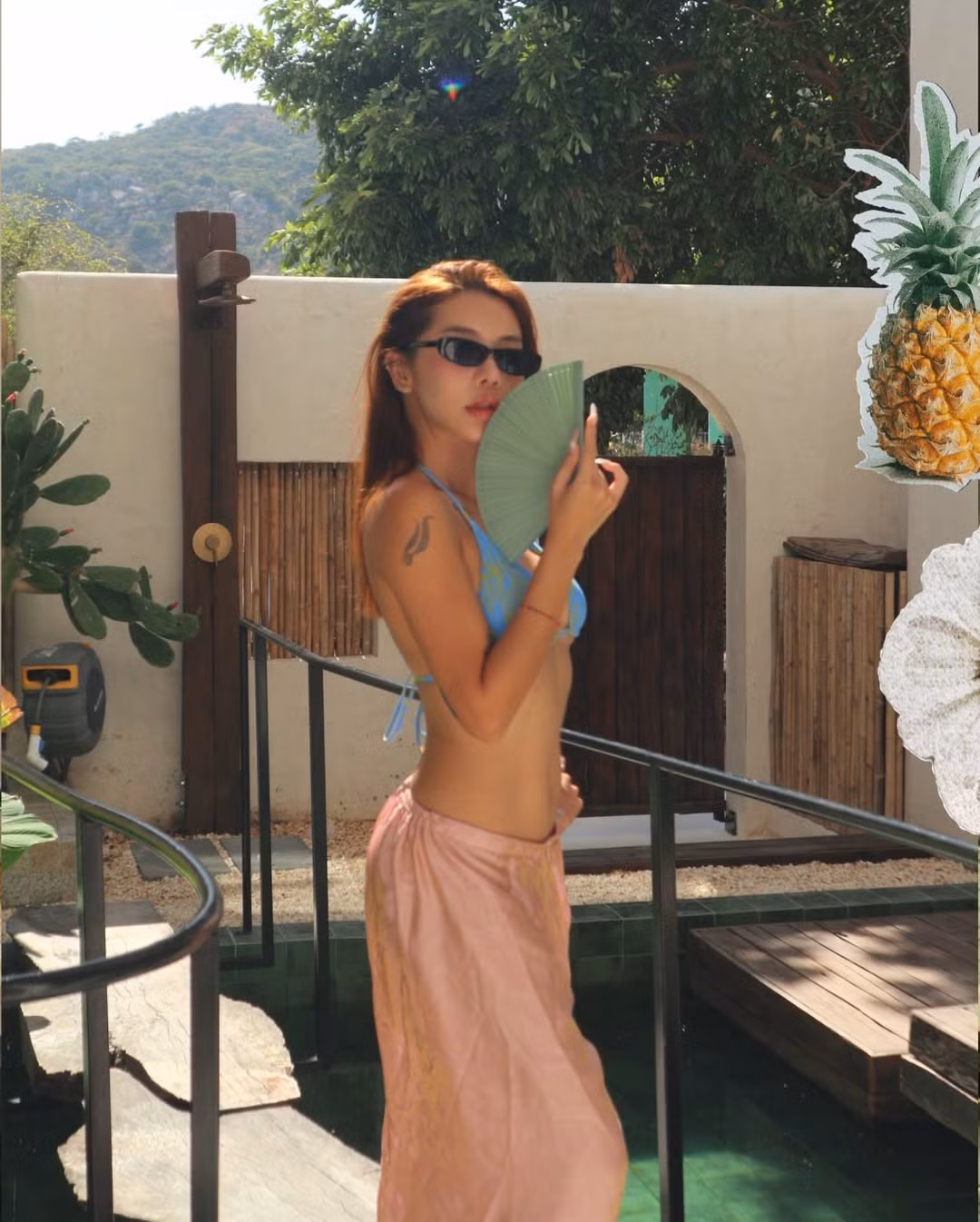 Không chỉ gây ấn tượng bởi vóc dáng, Hạt Mít còn khéo léo sử dụng các phụ kiện đi kèm để tăng thêm phần phong cách như kính râm hay chiếc quạt xếp. (Ảnh: IGNV)