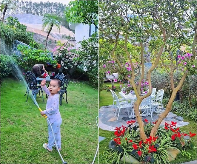 Khu vườn trước biệt thự là thảm cỏ xanh, có bộ bàn ghế sắt nhỏ tạo góc thư giãn ngoài trời. Ảnh chụp màn hình